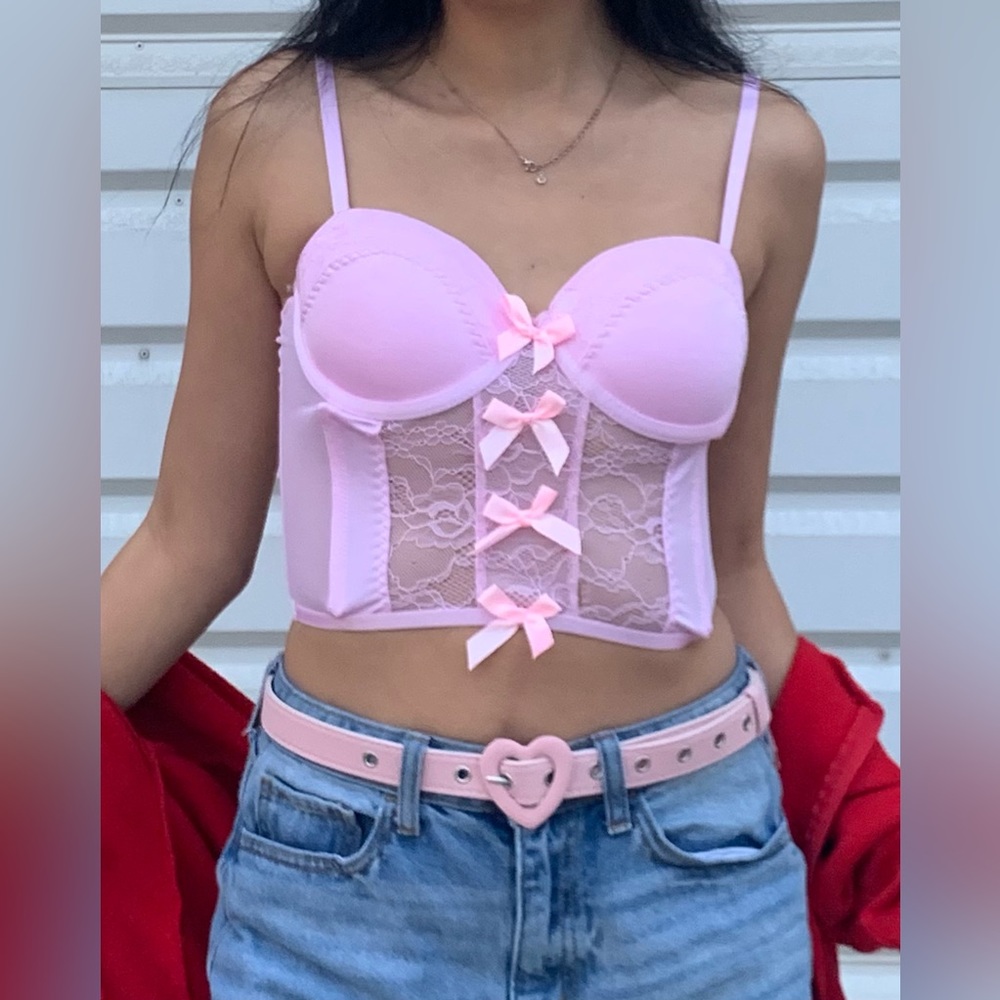 Spencer’s women’s pink corset with bows in the front